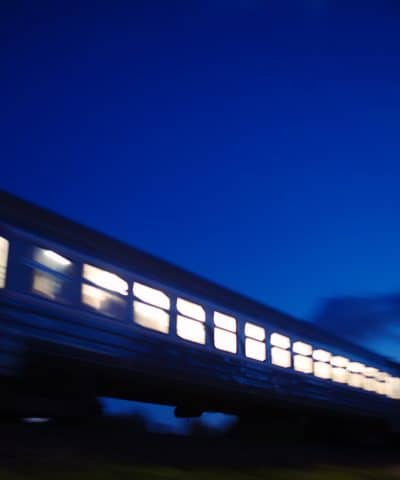 Hakim injury law Illuminated train traveling past at night