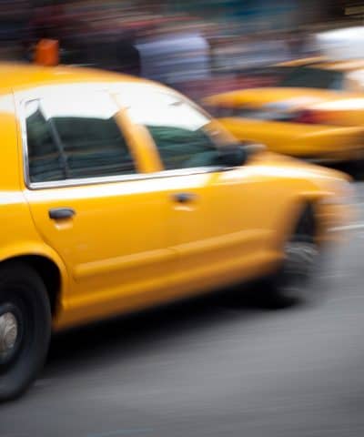 Hakim injury law Speeding Yellow Taxi Cabs Motion Blur